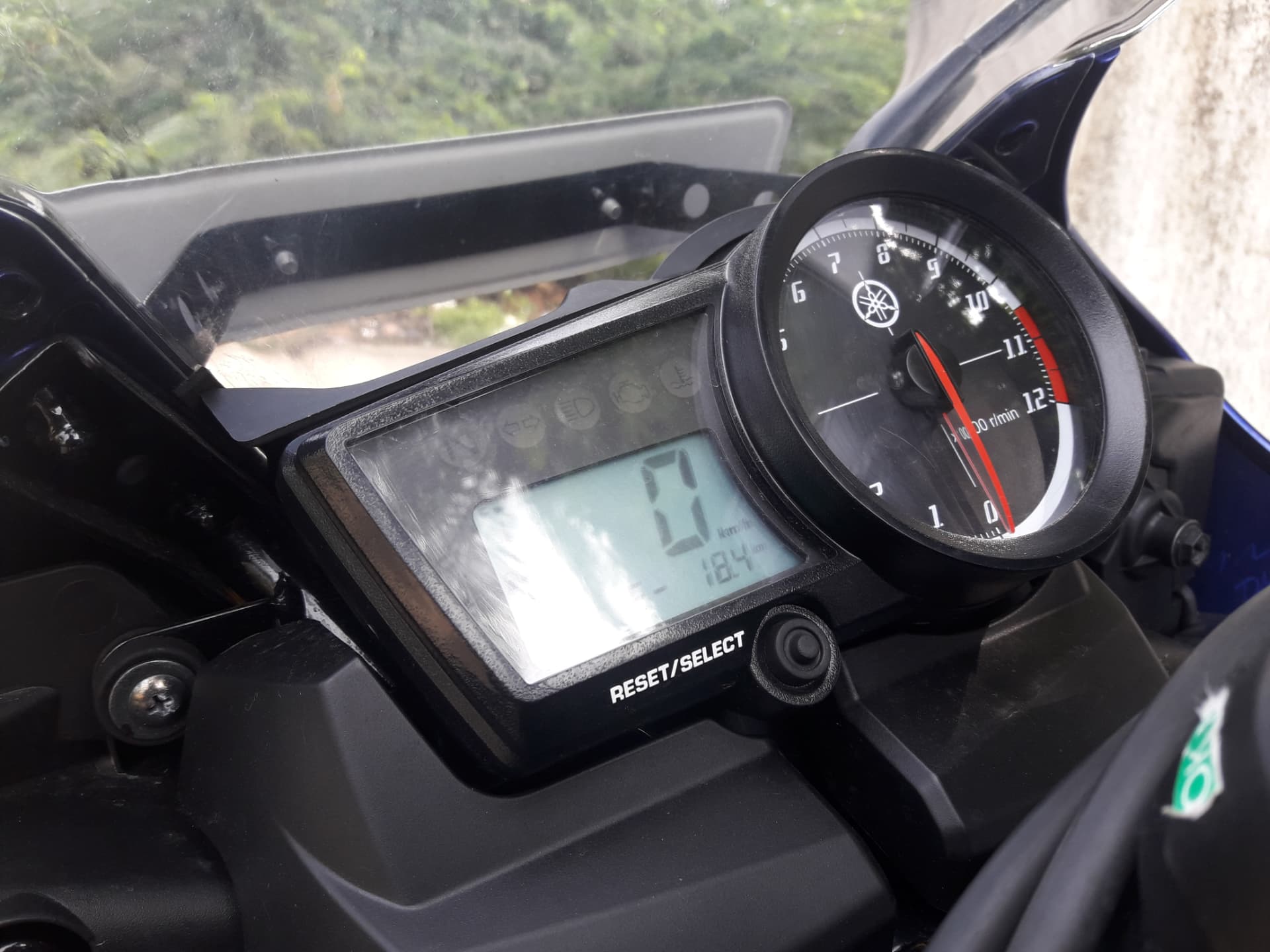 Close-up photograph of a Yamaha motorcycle speedometer and instrument panel