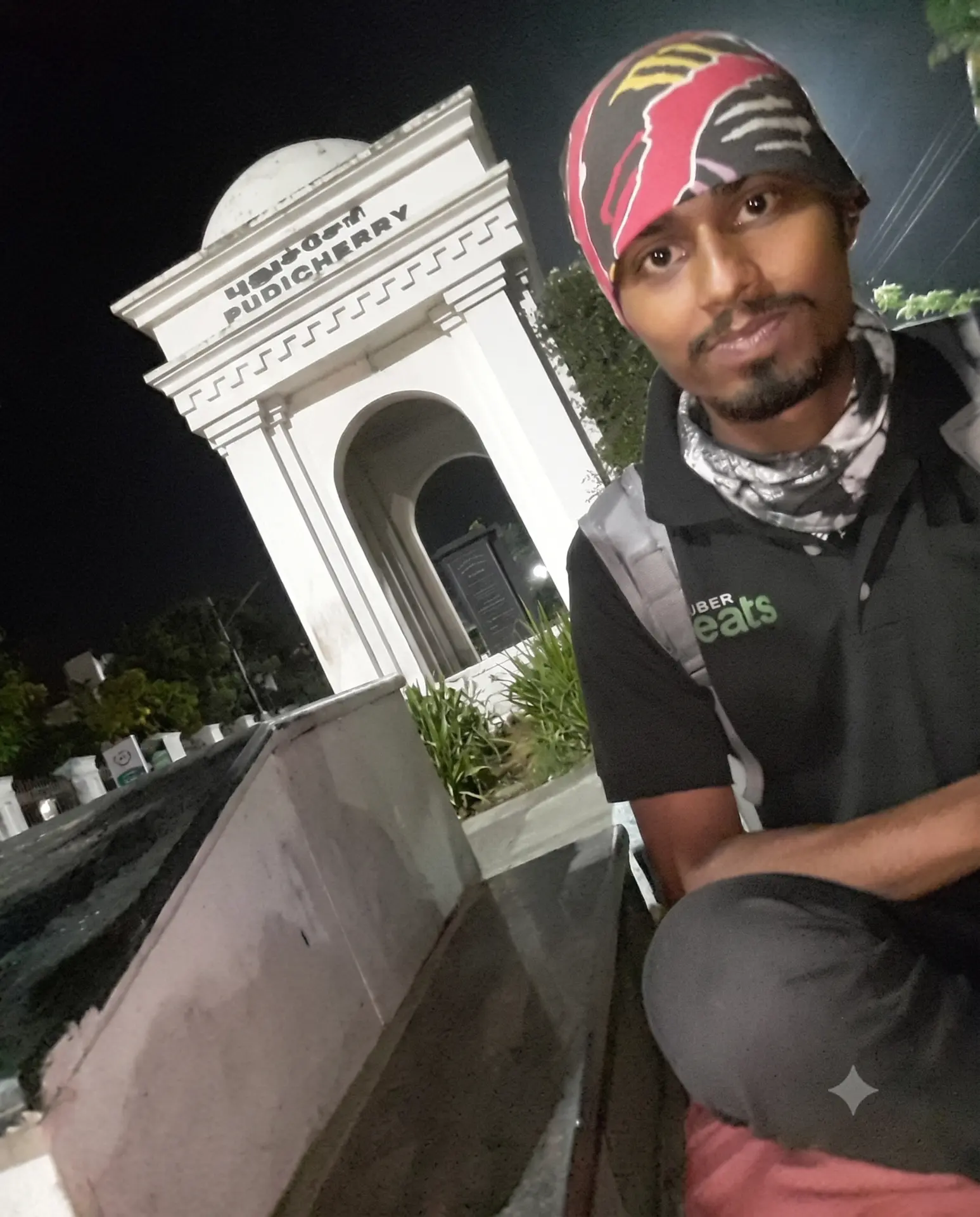 Suresh Veerasamy in Uber Eats delivery gear at night in Puducherry during his delivery partner years